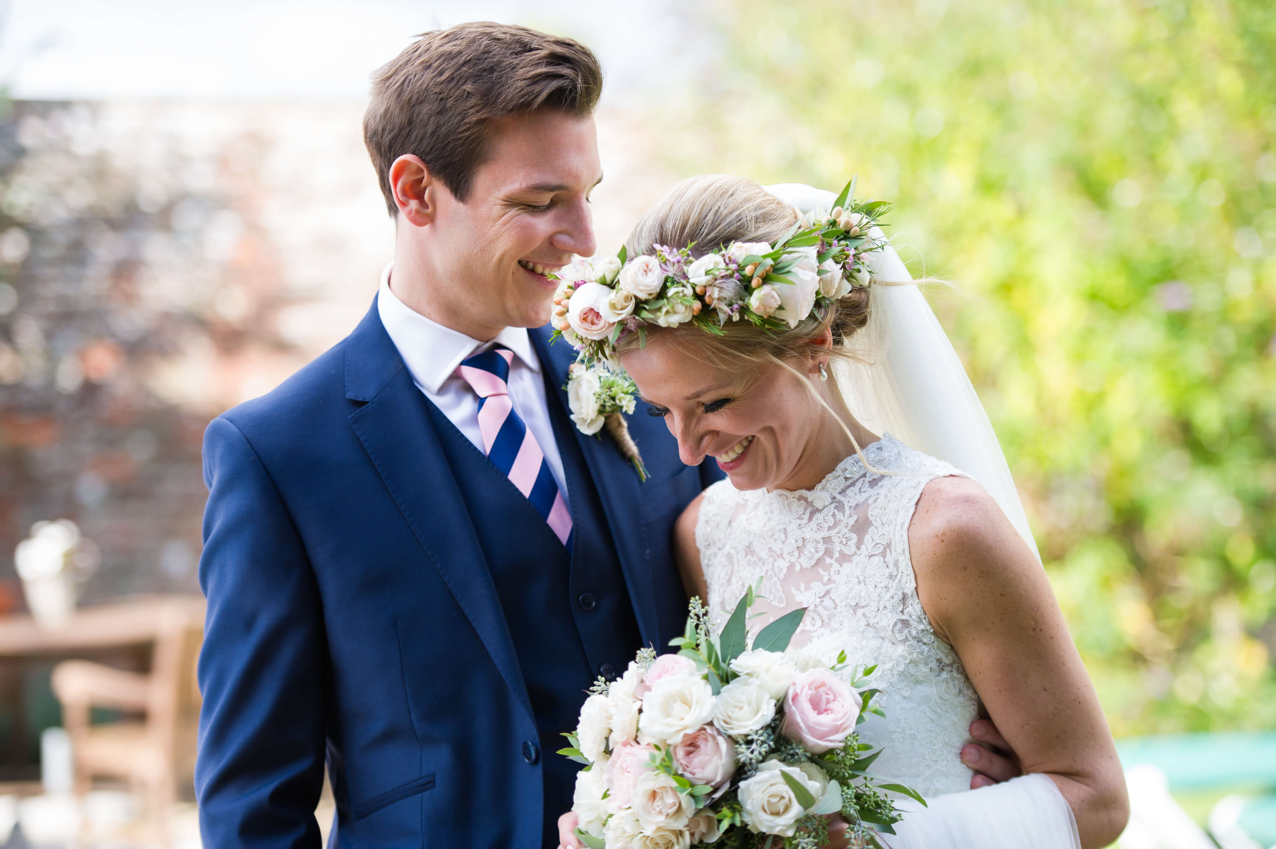 bride wearing flower crown at summer wedding