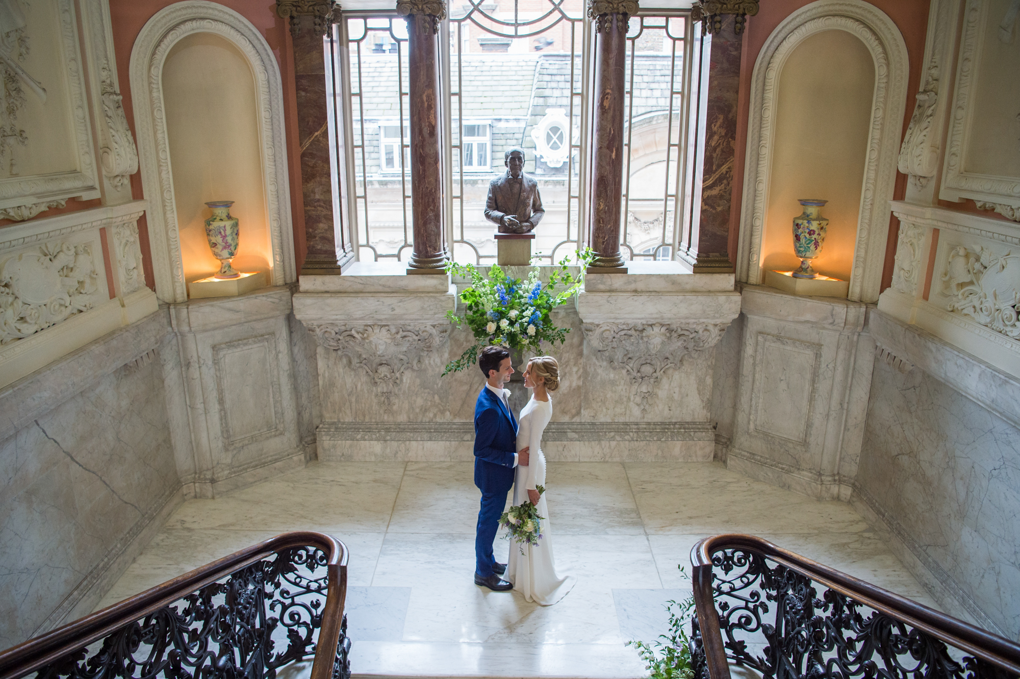 Bride and Groom on the stairs at Dartmouth House during their wedding reception
