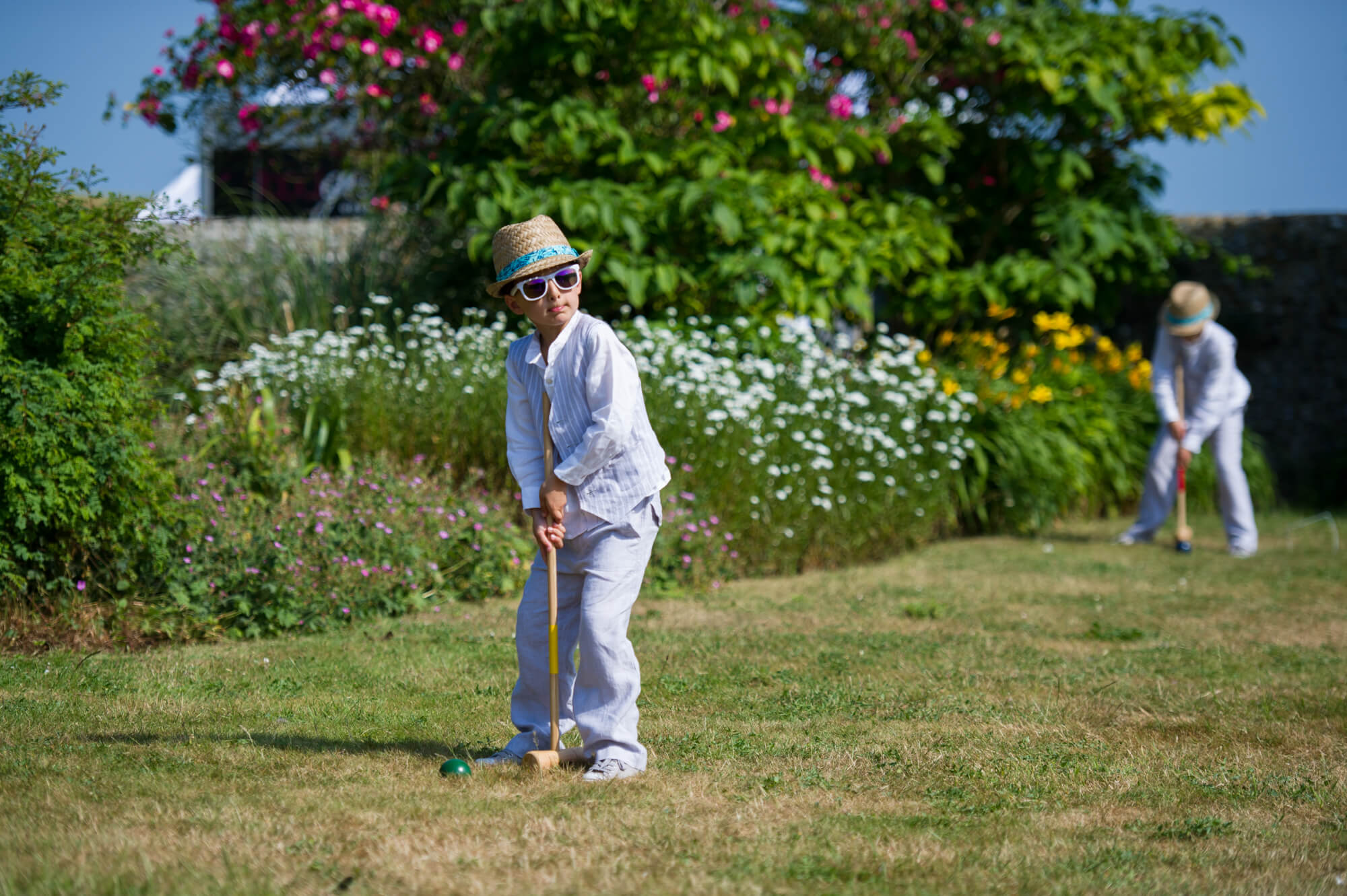 Playing cricket in the gardens of Birling Manor in Sussex