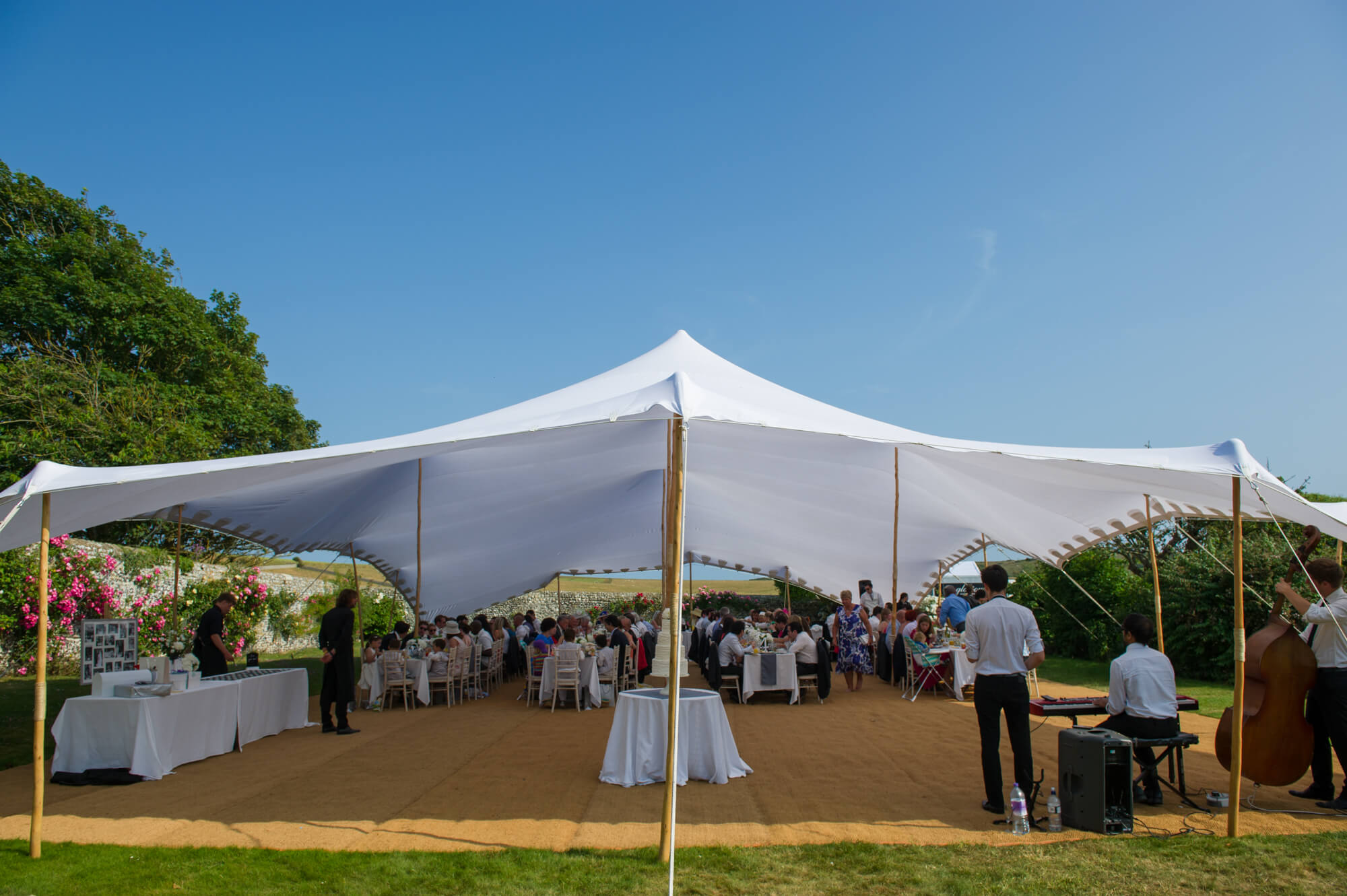 A stretch and tents marquee in the gardens of Birling Manor