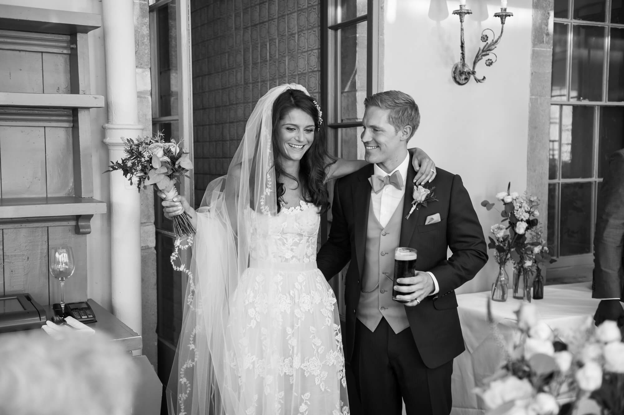 bride and groom enter the orangery for dinner at babington house