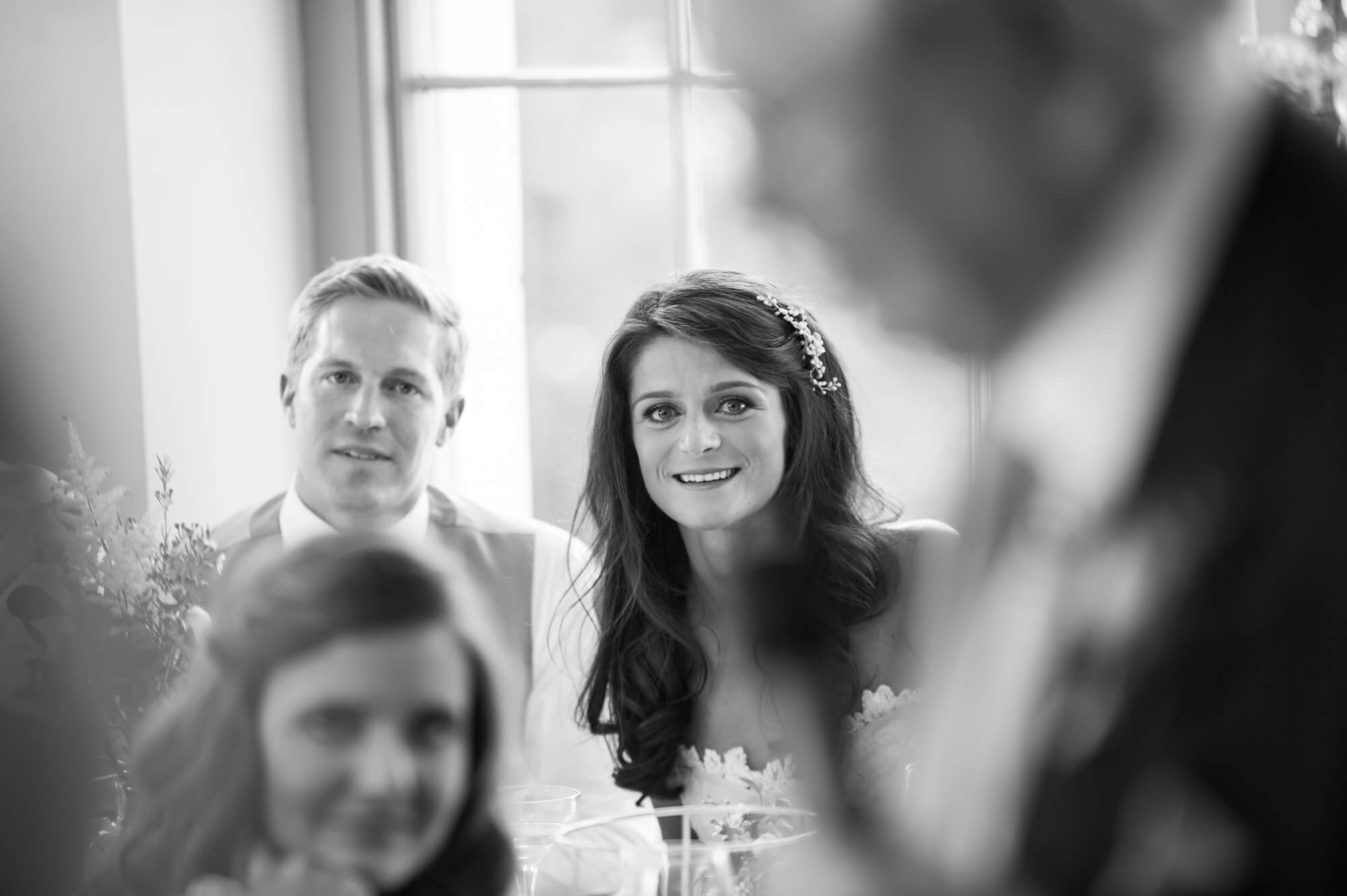 bride watching her grandfathers speech at babington house wedding