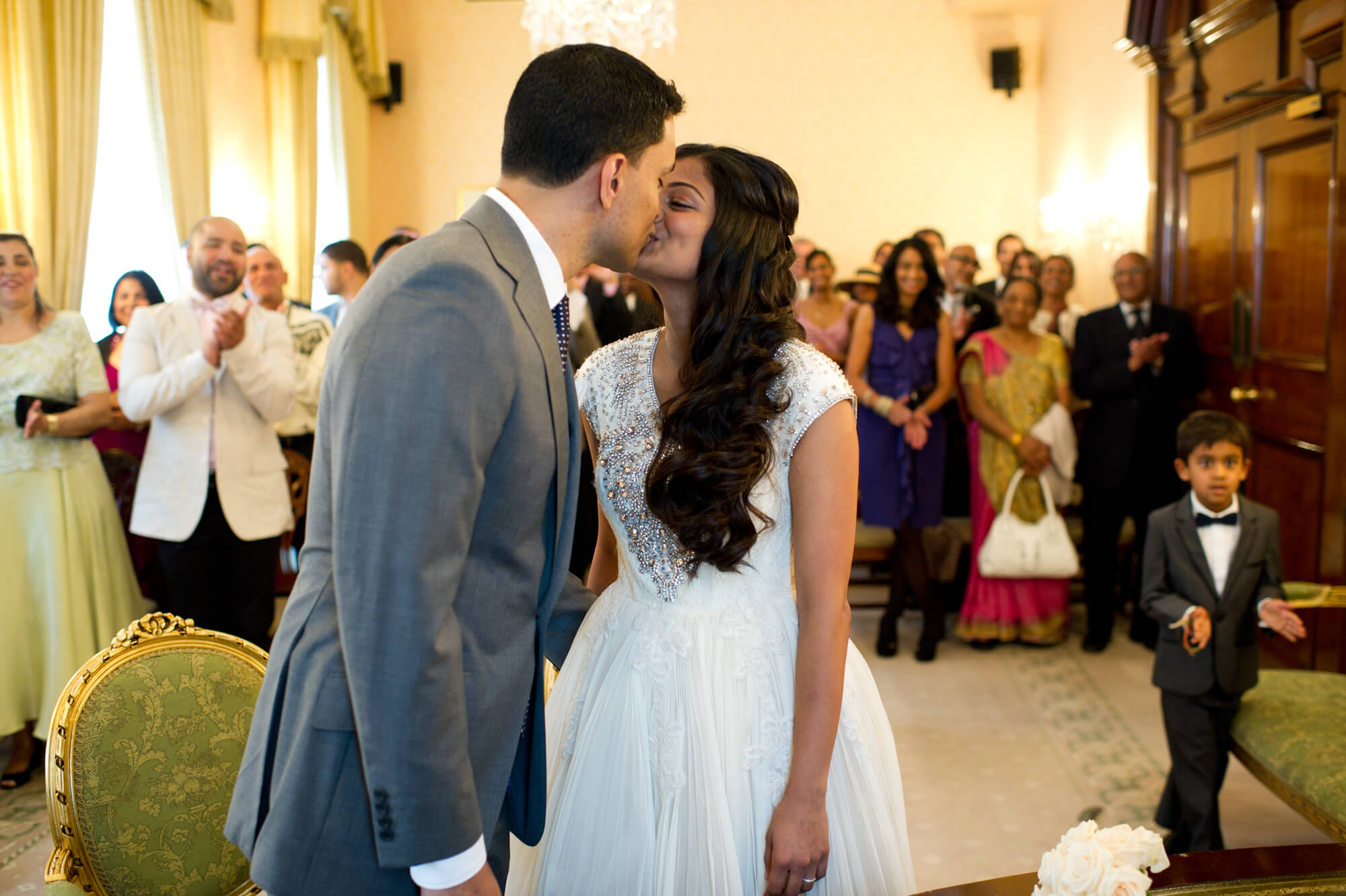 A couple getting married at Chelsea Town Hall in front of their friends and family