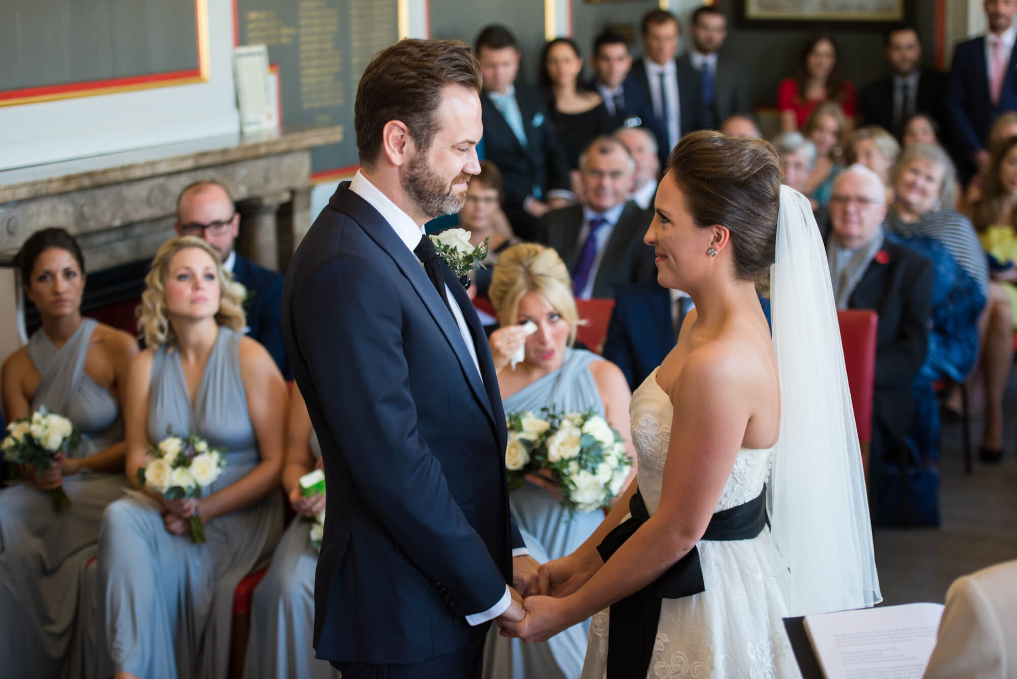 A couple getting married in front of friends and family at Rye town hall