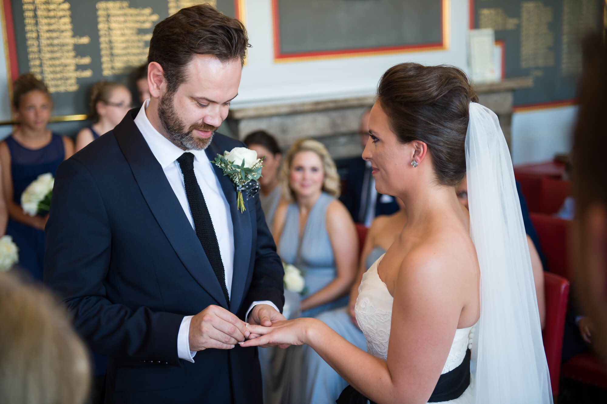 The bride and groom exchanging rings at Rye town hall