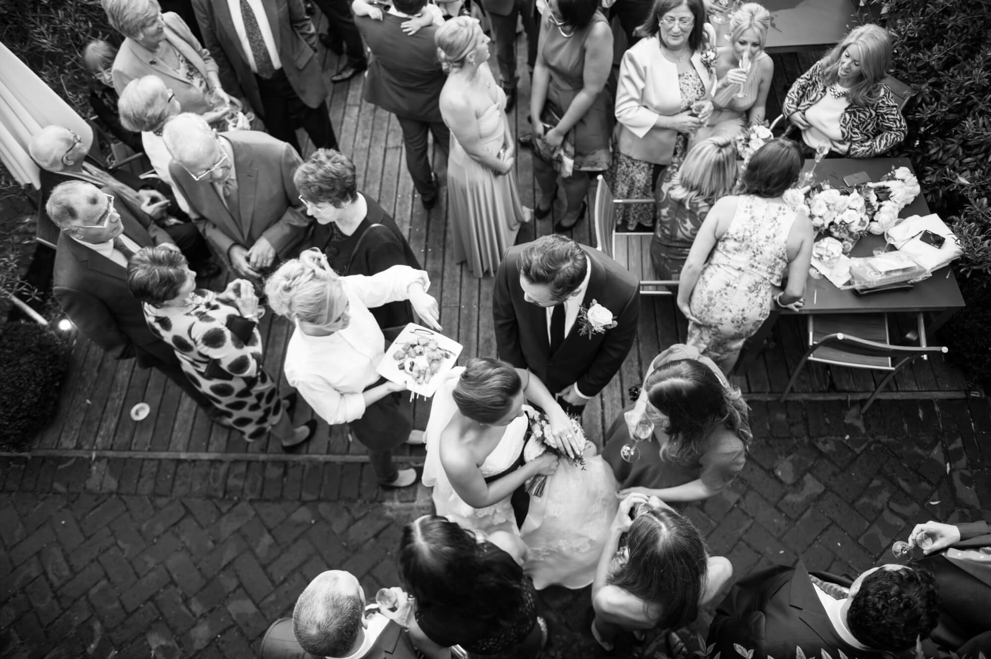 The guests enjoying a wedding celebration at the George Hotel in Rye