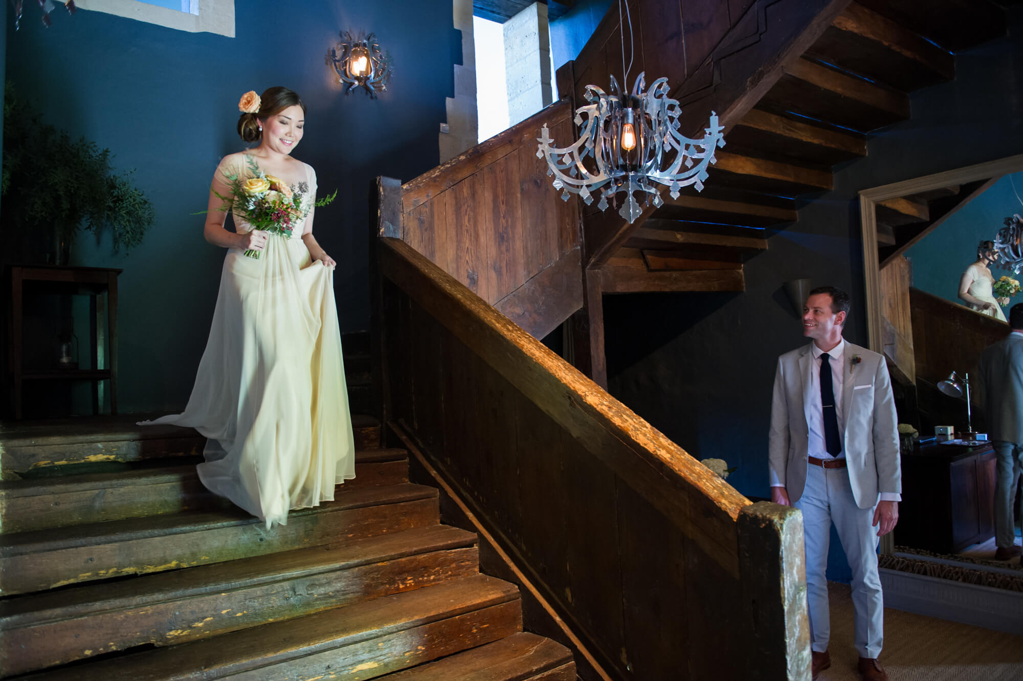 bride walking down the stairs to get married at chateau rigaud in france