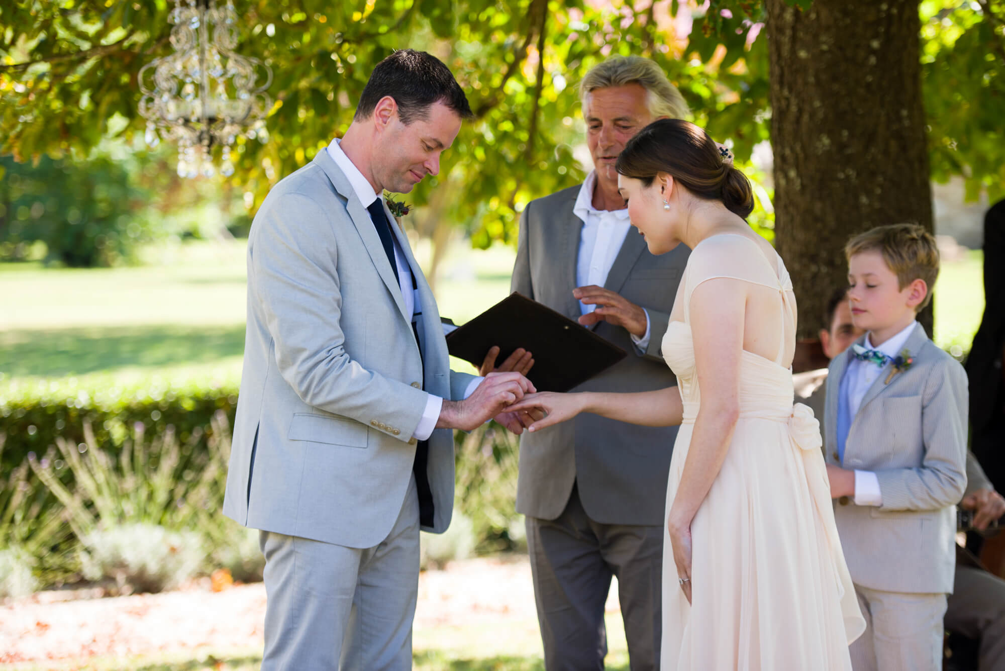 exchanging of rings at chateau rigaud outdoor ceremony by especially amy wedding photography