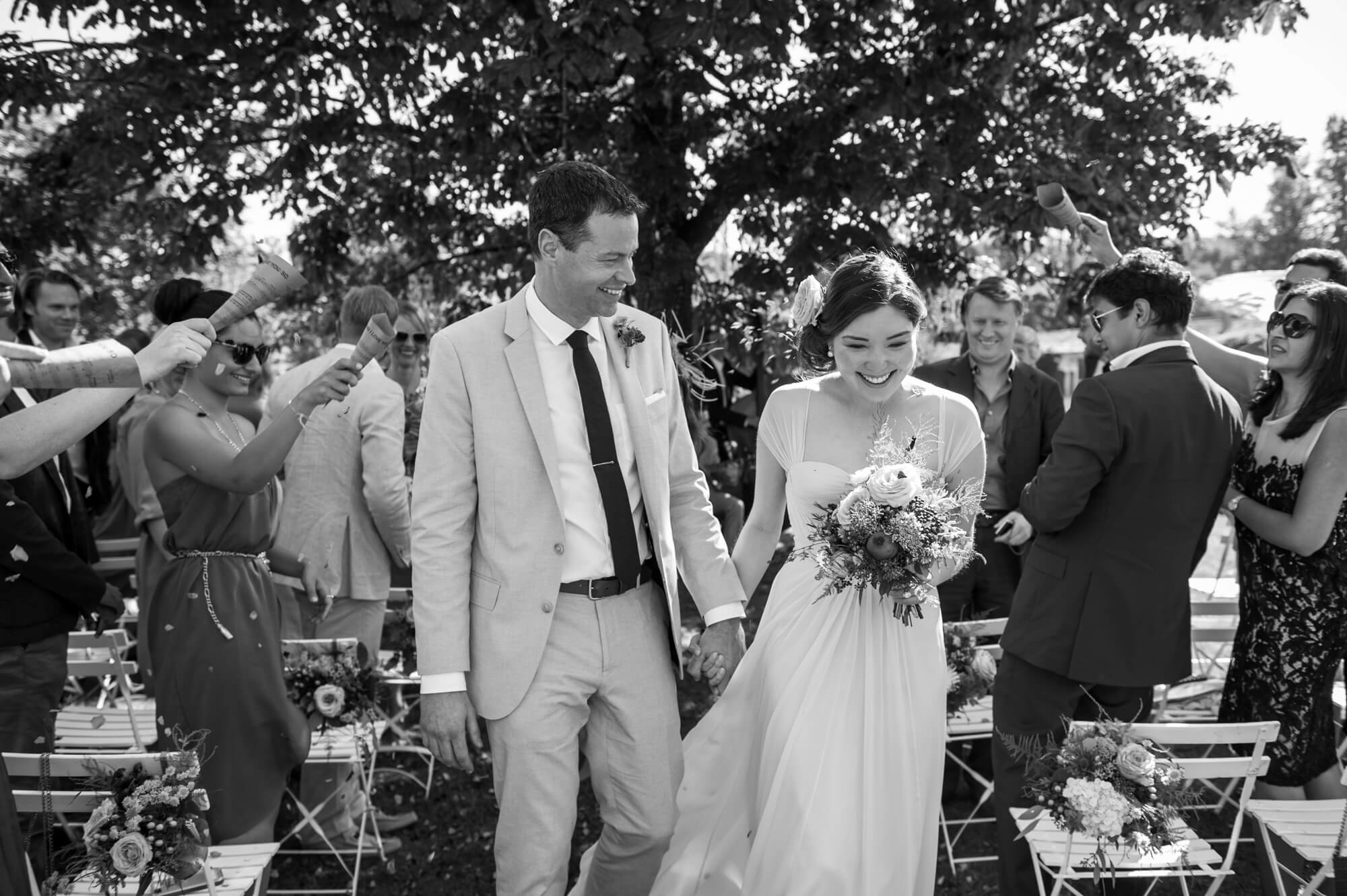 couple walking down the aisle at their outdoor ceremony by especially amy wedding photography