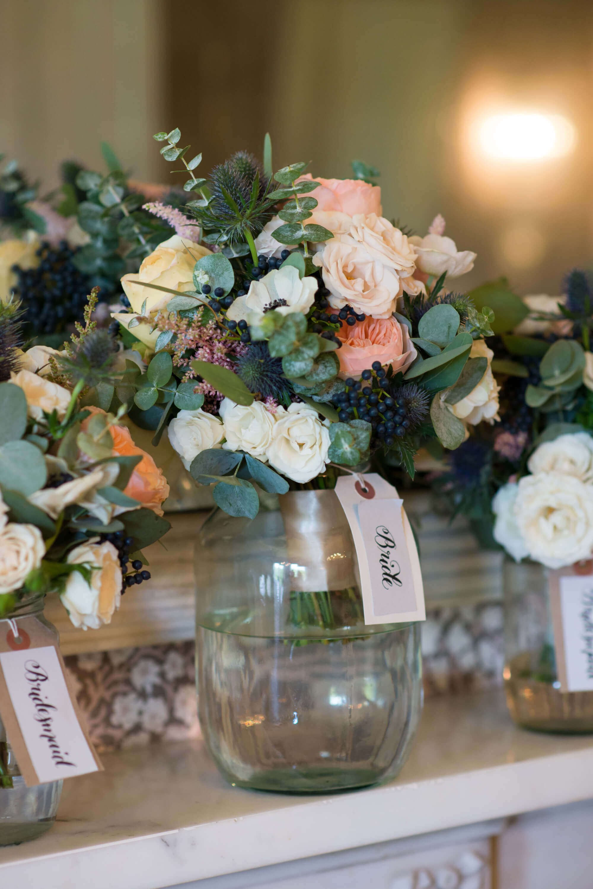 flowers by passion brides bouquet at babington house wedding on mantel piece