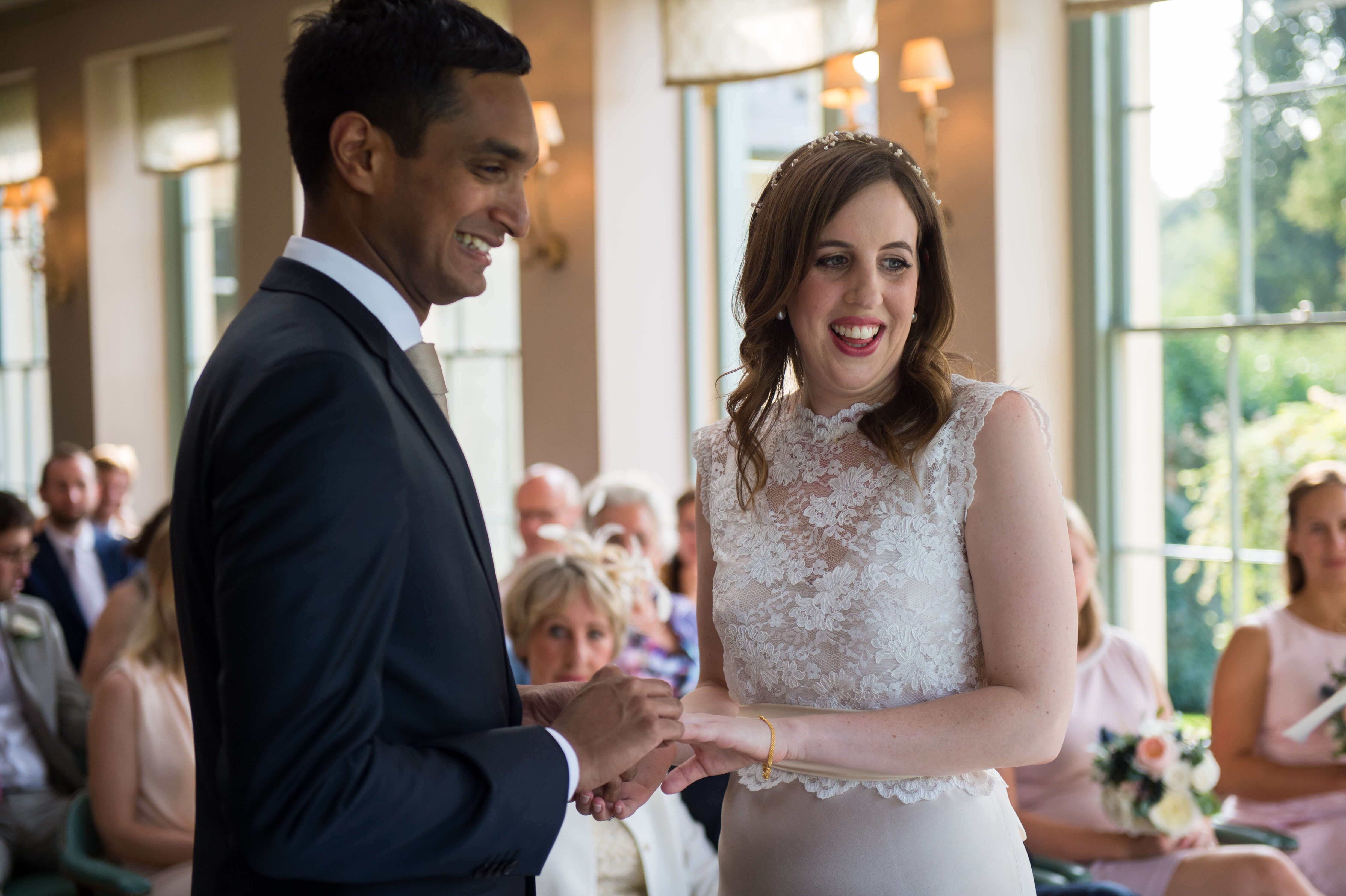exchange of rings at wedding in the orangery at babington house spring wedding