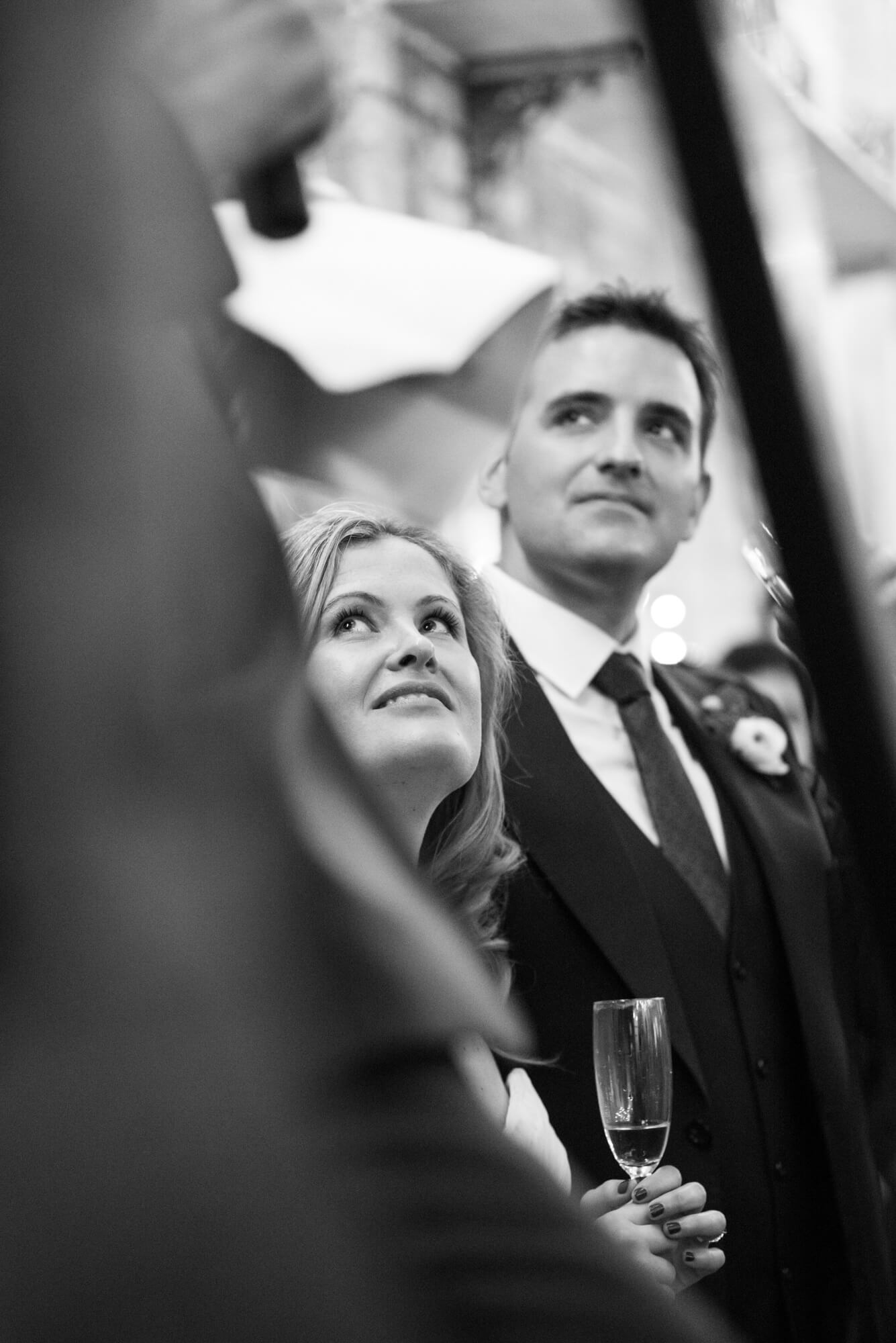 bride and groom listen to speeches at brixton east wedding reception venue image taken by especially amy wedding photography london