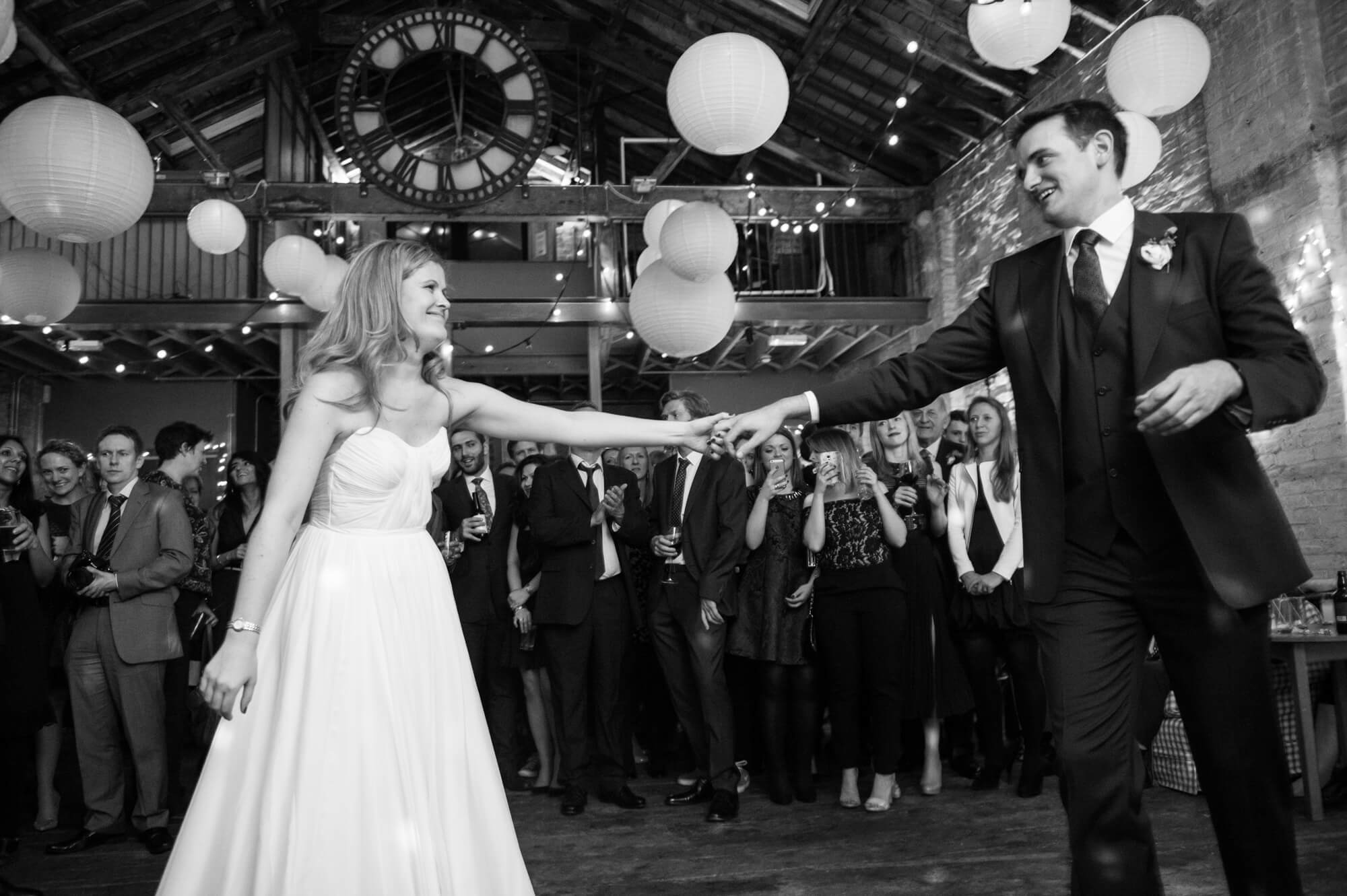 black and white photograph of bride and grooms first dance at brixton east wedding venue in south london taken by especially amy wedding photography