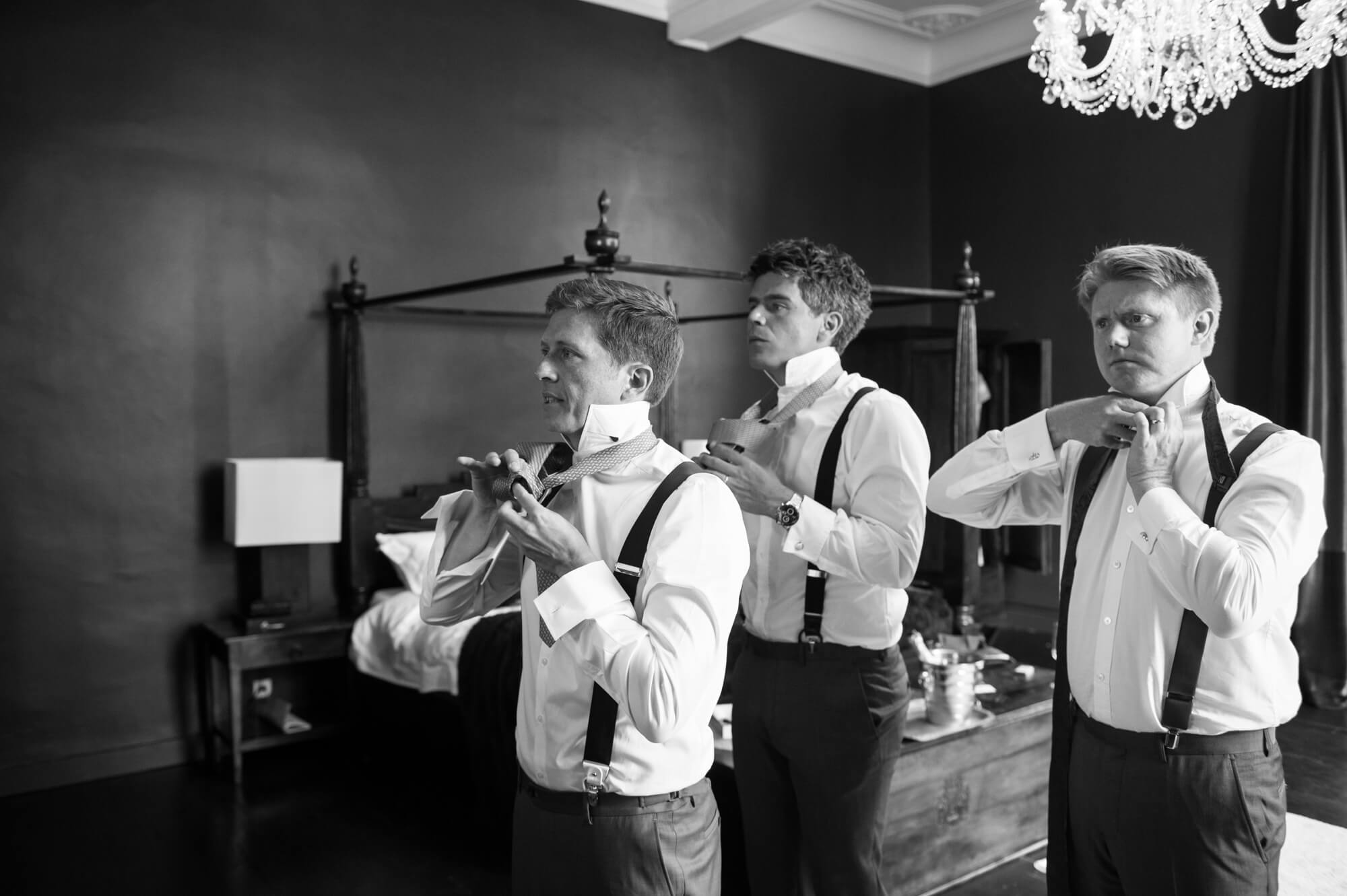 groom getting ready with his ushers at chateau rigaud
