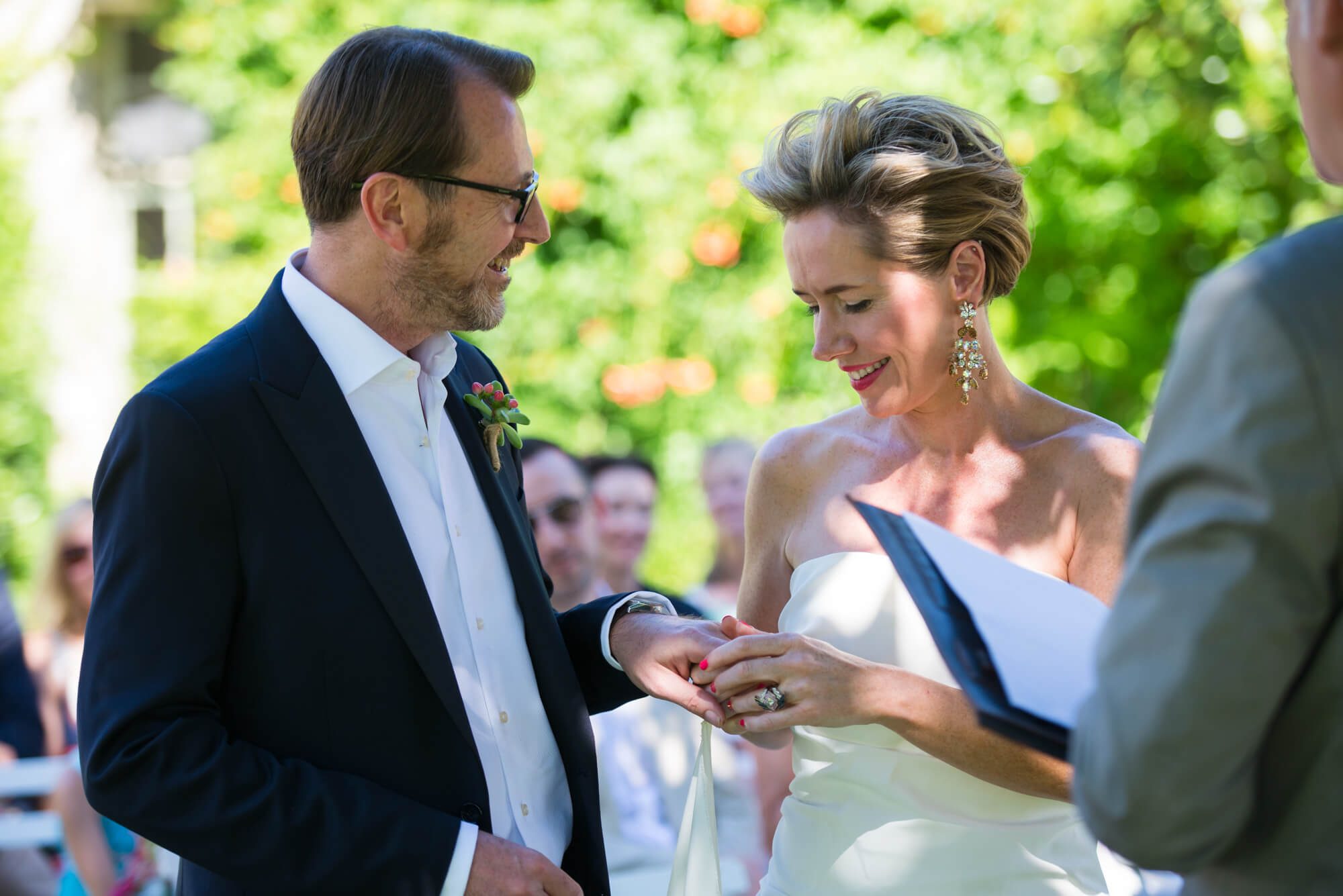 exchanging rings at chateau rigaud outside wedding ceremony