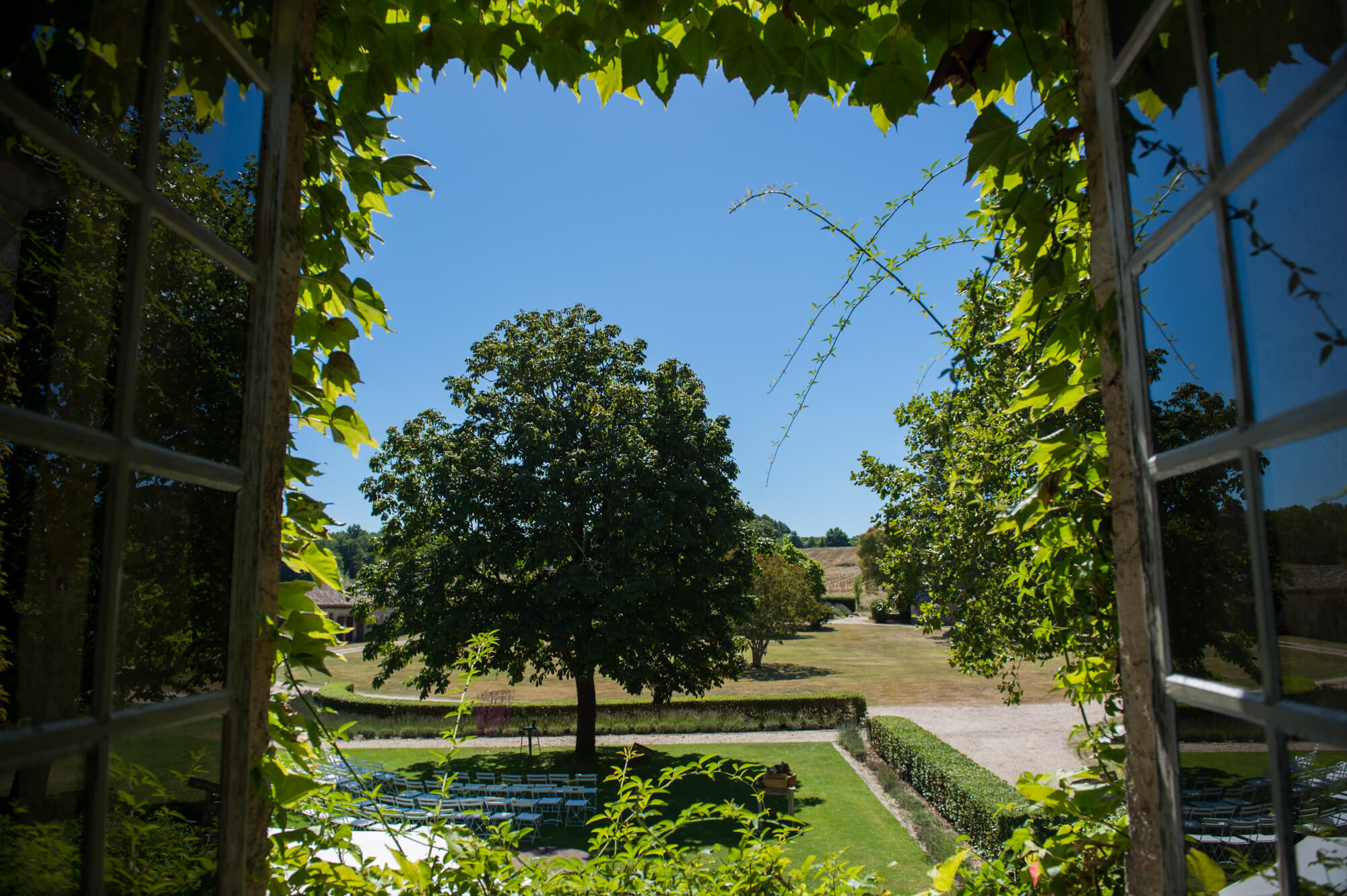 A view from the window at Chateau Rigaud showing blue skies and the stunning bordeaux countryside