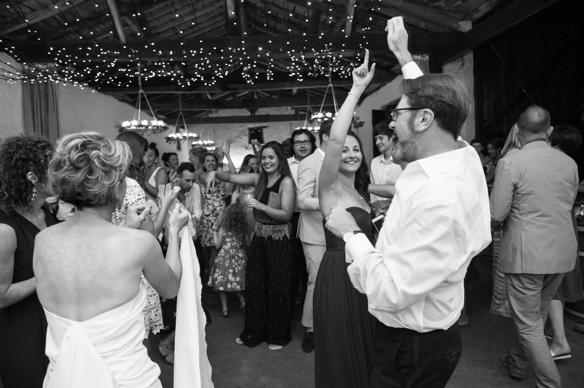 Guests dancing and laughing at a French wedding venue 
