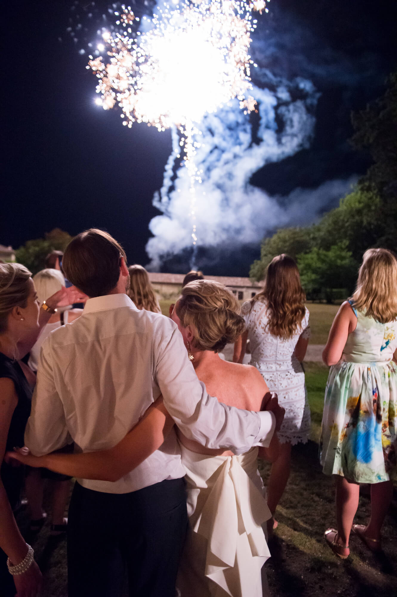 Wedding guests watching fireworks at Chateau Rigaud in France