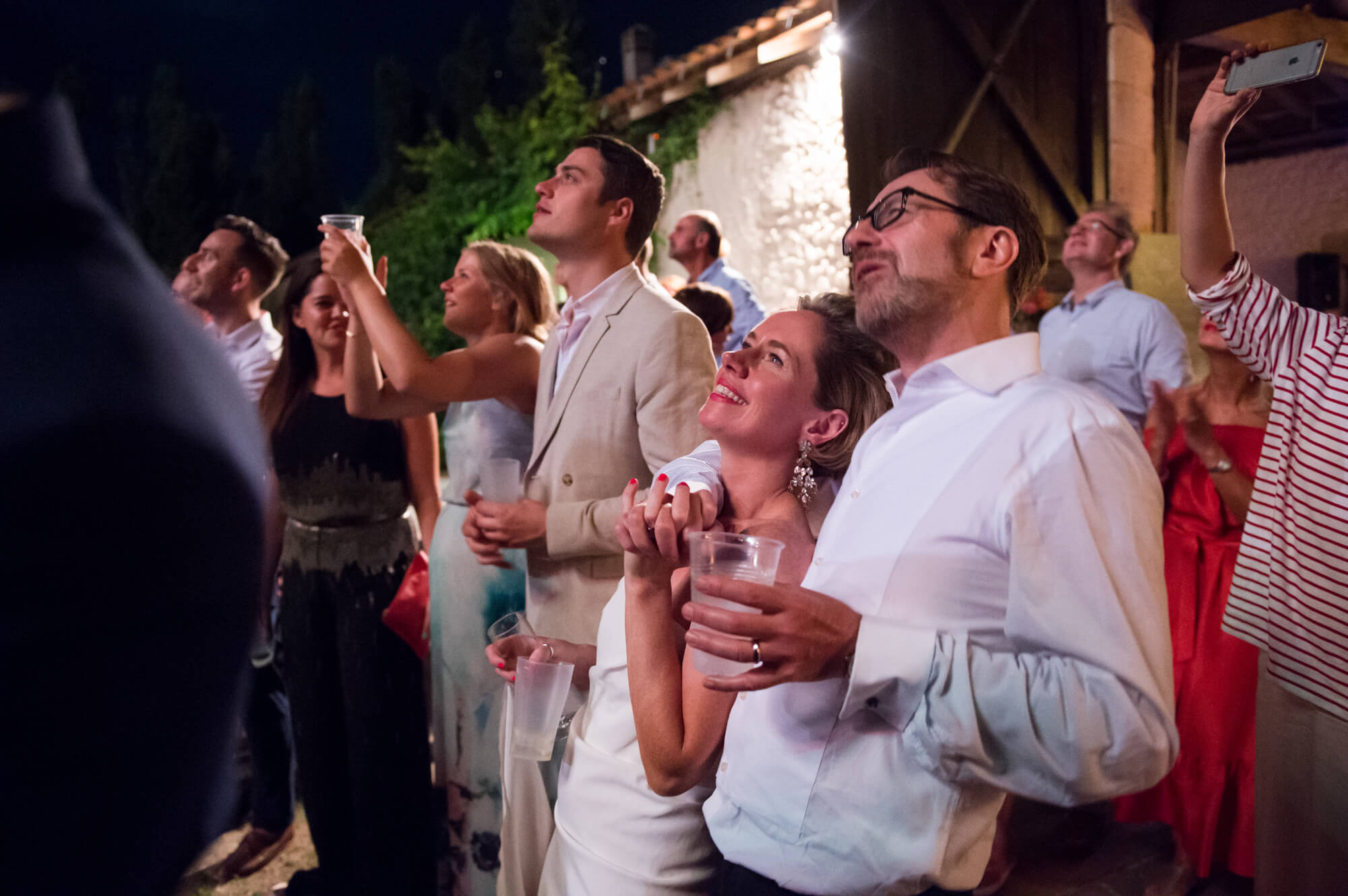 bride and groom watching fireworks at chateau rigaud