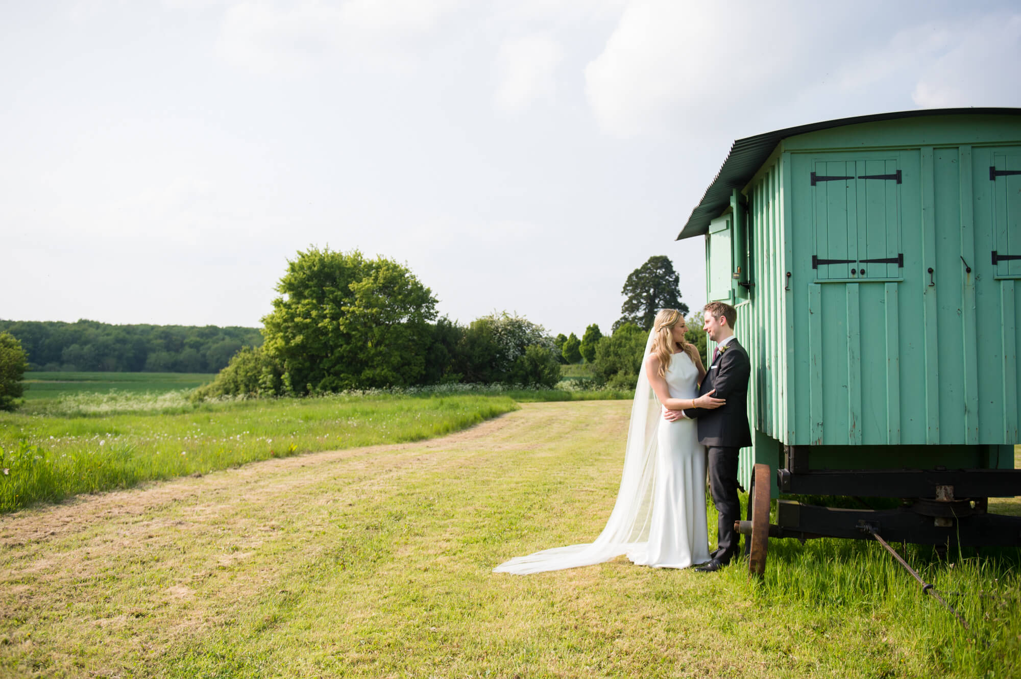 A newly married couple having their wedding photography at Merriscourt in Oxfordshire