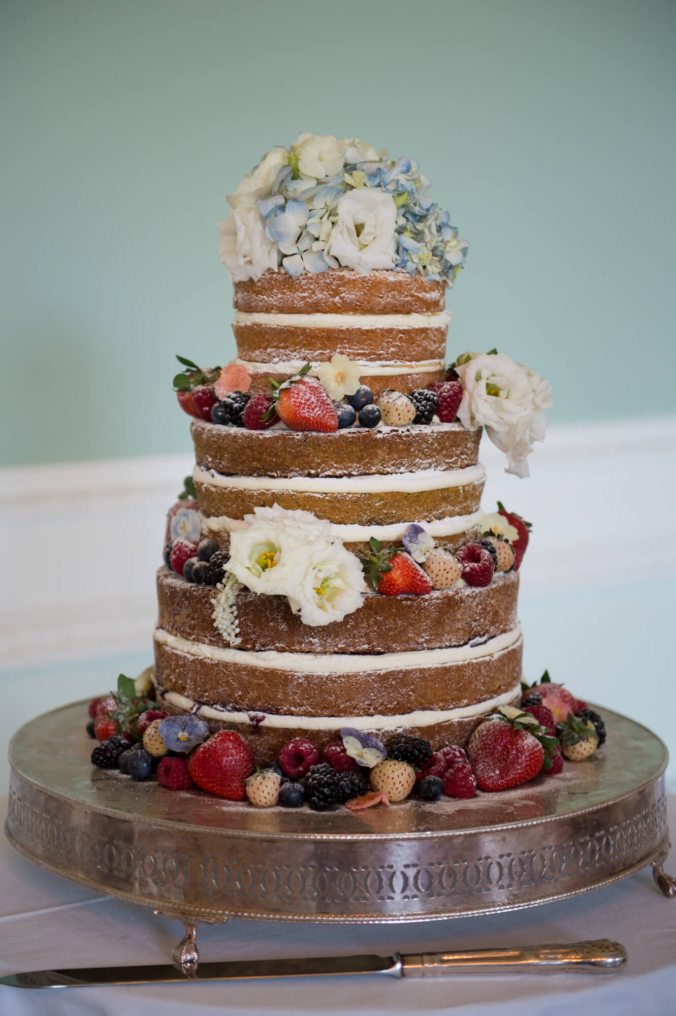 A 3 tier wedding cake made by Little Bear Cakery