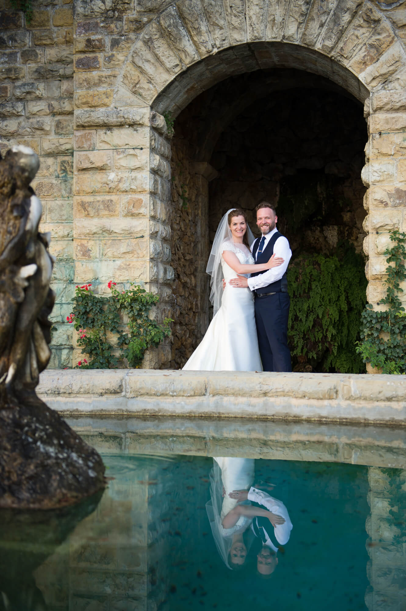 A newly married couple having their wedding photographs taken in Tuscany, Italy