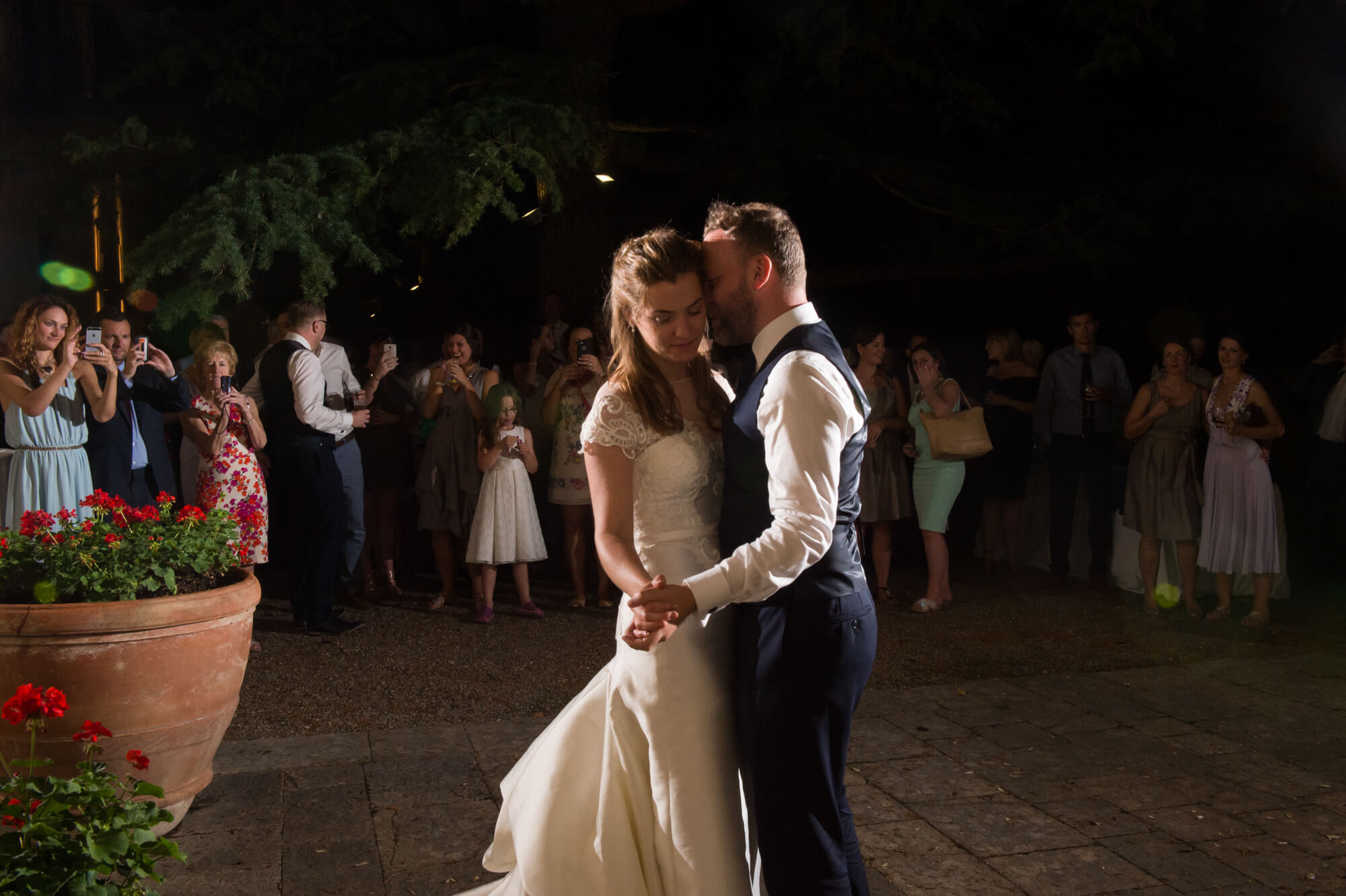 A newly married couple having their first dance in Tuscany, Italy.