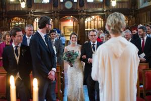 bride and her dad walking down the aisle at candlelit lincolns inn london wedding ceremony