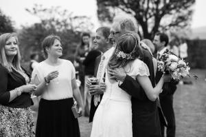 bride greeting her dad at birling manor wedding reception