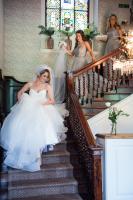 bride and bridesmaids walking down the stairs at babington house wedding photographed by especially amy